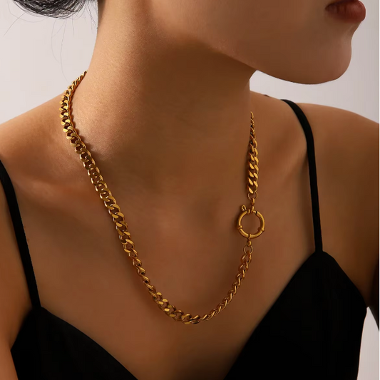 A gold-plated stainless steel curb chain necklace with a bold clasp.