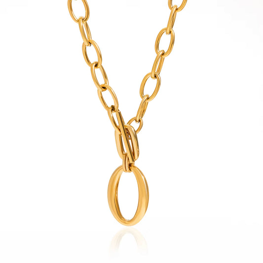 Gold chain necklace on a white background