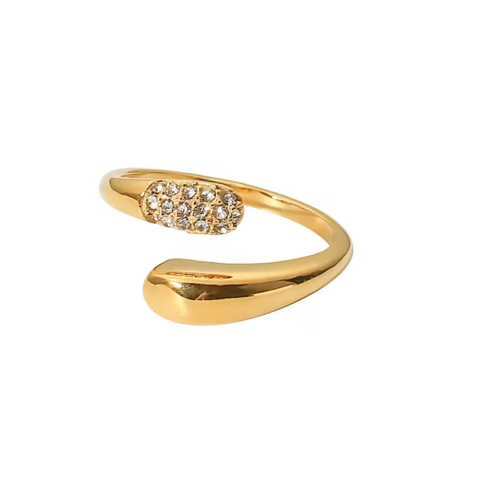 Gold open ring with gemstone accents on a white background