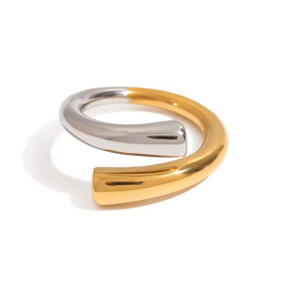 Two-toned gold and silver ring on a white background