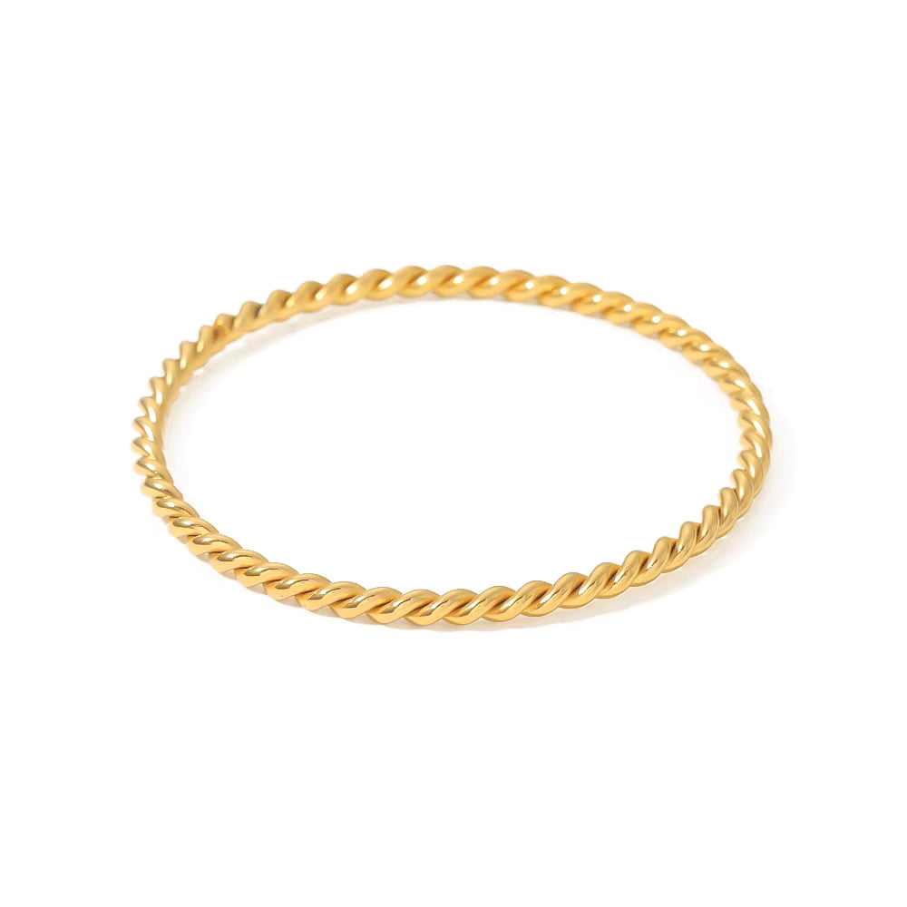 Gold rope bracelet on a white background