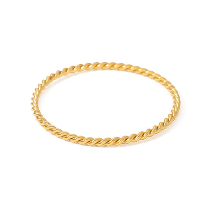 Gold rope bracelet on a white background