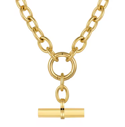 Gold chain necklace with a cylindrical pendant on a white background