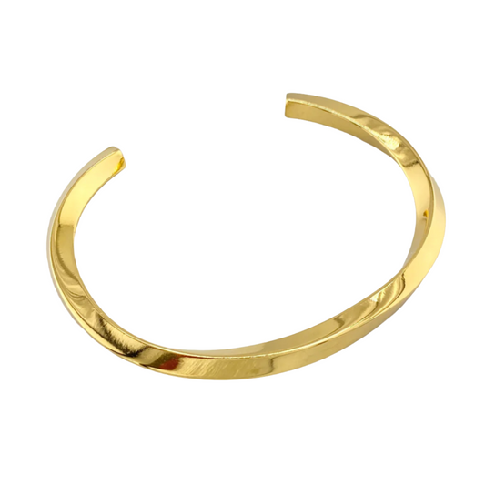 A gold-colored metallic cuff bracelet with a sleek, twisted design.