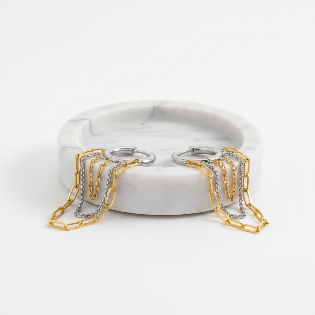 Pair of hoop earrings with chain extensions on a white background