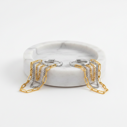 Pair of hoop earrings with chain extensions on a white background